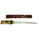 A JAPANESE TANTO DAGGER Having a shark skin handle set with gilt bronze fuchi and mounts, the dark