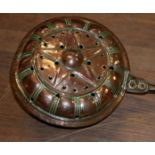A 19TH CENTURY COPPER BED WARMING PAN Along with a copper foot warmer, a brass shell case,