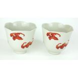 A PAIR OF CHINESE PORCELAIN 'BAT' CUPS Having a lobed form rim, hand painted with bats in flight and