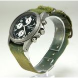 SEKONDA, A VINTAGE 10ATM STAINLESS STEEL WRISTWATCH Black and cream dial, on a green canvas