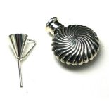 A STERLING SILVER MINIATURE SPHERICAL PERFUME BOTTLE AND FUNNEL With fluted design. (approx 3cm)