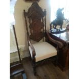 A PAIR OF 19TH CENTURY OAK OPEN ARMCHAIRS With heavily carved back panels, acanthus carved arms,