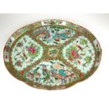 A 19TH CENTURY CHINESE CANTONESE FAMILLE ROSE OVAL TRAY Decorated with court scenes. (40cm x 34cm)