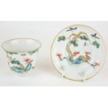 A CHINESE FAMILLE VERTE PORCELAIN 'DEER AND MONKEY' CUP AND SAUCER Hand painted with a recumbent