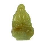 A CHINESE CARVED JADE FIGURE OF A SEATED BUDDHA Clutching a peach on a lotus flower base. (approx