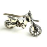 A STERLING .925 SILVER MINATURE MODEL OF A SCRAMBLER MOTORCYCLE. (w 7cm)