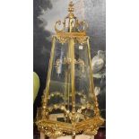A LARGE POLISHED BRASS LANTERN The hexagonal tapering etched glazed panels above swags, shells and