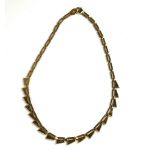 A VINTAGE 9CT GOLD FANCY LINK NECKLACE Having pierced geometric form links. (approx 42cm)