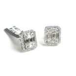 A PAIR OF 18CT WHITE GOLD AND 1.89CT DIAMOND STUD EARRINGS Having an arrangement of baguette cut