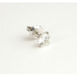 AN 18CT WHITE GOLD AND DIAMOND SINGLE STUD EARRING The round cut solitaire diamond on a white gold