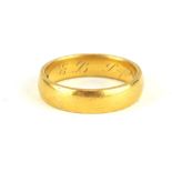 A 22CT GOLD WEDDING BAND (size N).