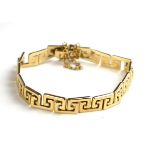 A VINTAGE 9CT GOLD BRACELET Having Greek Key design geometric form links. (approx 18cm)