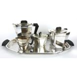 AN ART DECO SILVER PLATED FIVE PIECE TEA SERVICE Geometric form with ebonised finials and handles,