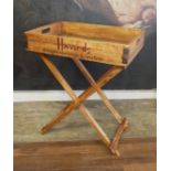HARRODS, A WOODEN BUTLER'S TRAY ON FOLDING STAND. (66cm x 45cm x 71cm)