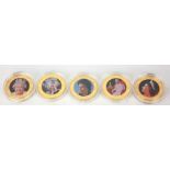 A COLLECTION OF FIVE 24CT GOLD PLATE AND ENAMEL FIFTY PENCE PIECES Commemorating Queen Elizabeth