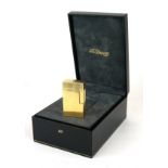 DUPONT, AN 18CT GOLD POCKET LIGHTER Having engraved vertical line decoration and hinged lid,