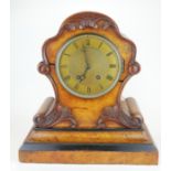 A VICTORIAN WALNUT MANTLE CLOCK The cartouche shaped case with engine turned brass dial and