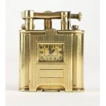 DUNHILL, AN ART DECO 14CT GOLD 'UNIQUE' WATCH LIGHTER Square form with engraved engine turned