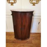 A GEORGIAN MAHOGANY BOW FRONTED WALL HANGING CORNER CABINET With two doors enclosing shelves,
