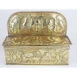 A 19TH CENTURY DUTCH PROVINCIAL BRASS CANDLE BOX AND COVER Repoussé embossed with rural harvest