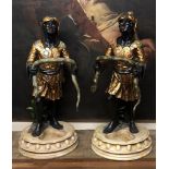 A PAIR OF BLACKAMOOR FIGURAL STICK STANDS Venetian dress, holding serpents. (h 123cm)