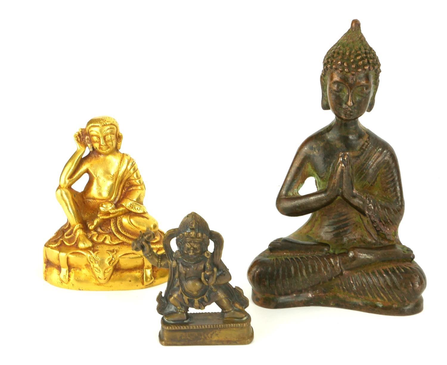 A COLLECTION OF THREE CHINESE MINIATURE BRONZE BUDDHA Comprising a gilt metal Buddha in seated