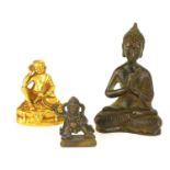 A COLLECTION OF THREE CHINESE MINIATURE BRONZE BUDDHA Comprising a gilt metal Buddha in seated