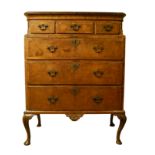 A MID 18TH CNETURY FIGURED WALNUT TALLBOY With an arraignment three short above three long graduated