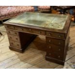 A 19TH CENTURY MAHOGANY PARTNER'S DESK With green tooled leather surface above an arrangement of