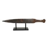 A RARE GREEK ARCHAIC IRON SWORD, CIRCA 600BC With tapering fullered blade, on museum display