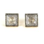 A PAIR OF CONTINENTAL SILVER GILT AND DIAMOND EARRINGS Square form with rough cut diamond to centre,