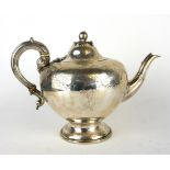 A VICTORIAN SILVER TEAPOT Having a melon form finial and engraved decoration, hallmarked AB Savory