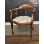 AN EDWARDIAN MAHOGANY AND SHELL MARQUETRY INLAID OPEN ARMCHAIR With pierced rails, serpentine