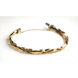 AN ITALIAN 9CT GOLD BRACELET Having a cross design link. (approx 18cm)