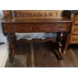 A REGENCY PERIOD MAHOGANY AND BRASS INLAID SOFA TABLE With two real and two false drawers, raised on