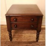 A VICTORIAN MAHOGANY LOW SIDE TABLE With rise and fall top above two false drawers, raised on turned