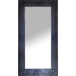 A REGENCY DESIGN FRENCH GREY MIRROR Carved with floral cartouches, bevelled plate. (96cm x 182cm)