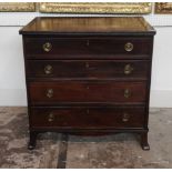 A GEORGIAN MAHOGANY BACHELOR'S CHEST OF FOUR GRADUATED DRAWERS With brass loop handles, raised on
