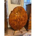 A GOOD VICTORIAN BURR AND FIGURED WALNUT OVAL DINING TABLE With floral marquetry inlay, raised on