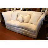 A PAIR OF LARGE TWO SEAT KNOLE DROP END SOFAS In cream floral fabric, complete with loose