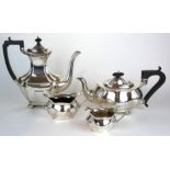 AN EARLY 20TH CENTURY MATCHED FOUR PIECE SILVER TEA SERVICE Comprising a fluted teapot, sugar