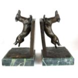 A PAIR OF BRONZE BOOKENDS Figured with dachshunds, on green marble bases. (32cm) Condition: good
