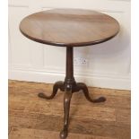 A GEORGIAN SOLID CUBAN MAHOGANY TILT TOP SUPPER TABLE The circular top raised on a cannon barrel