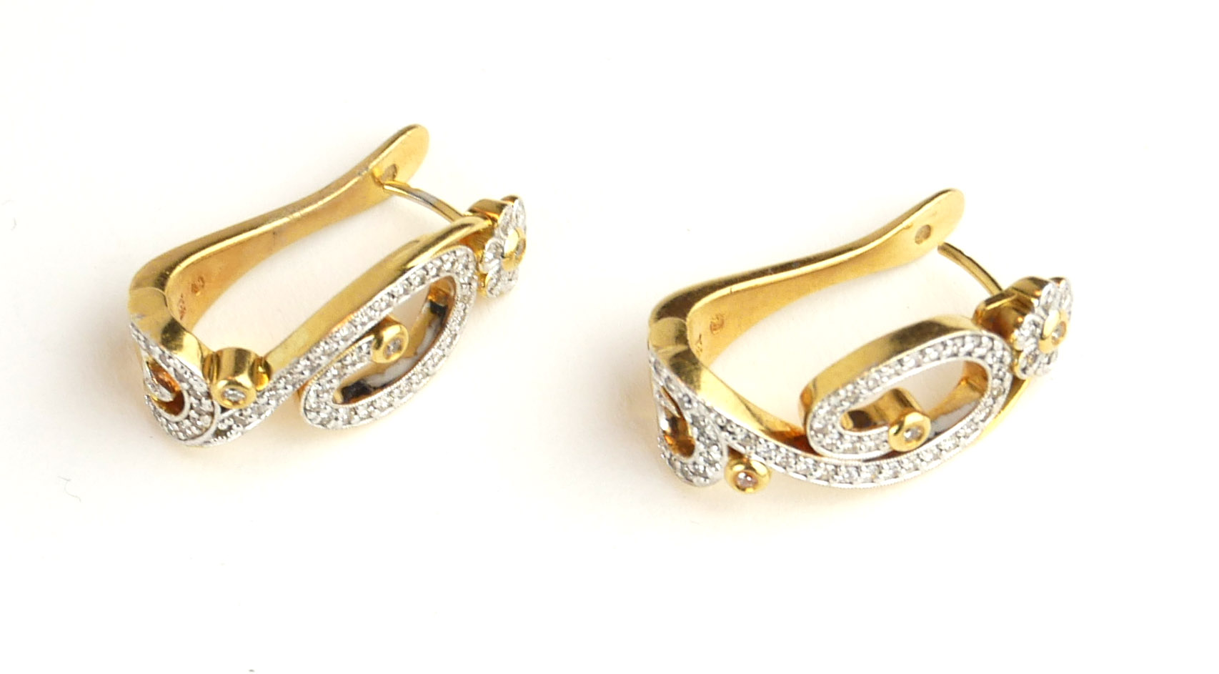 A PAIR OF 18CT GOLD AND DIAMOND EARRINGS Having a pavé set diamond scrolled design within a round - Image 2 of 2