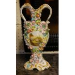 COALBROOKDALE, A 19TH CENTURY PORCELAIN VASE Having twin loop handles, applied floral bocage and