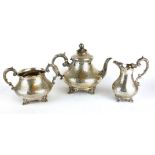 GOLDSMITHS AND SILVERSMITHS, A VICTORIAN THREE PIECE TEA SERVICE Comprising a teapot, sugar basin