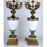 A PAIR OF LARGE CONTINENTAL BRASS AND BISQUE FOUR BRANCH TABLE LAMPS The bodies with relief
