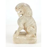 A CHINESE CARVED STONE TEMPLE LION Seated pose with grotesque features, on a square plinth. (