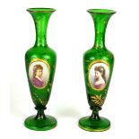 A PAIR OF MID 19TH CENTURY BOHEMIAN GREEN OVERLAY BALUSTER VASES The middle sections finely