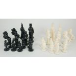 A 20TH CENTURY CENTRAL EUROPEAN IVORINE BLACK AND WHITE FIGURAL CHESS SET Complete set, four